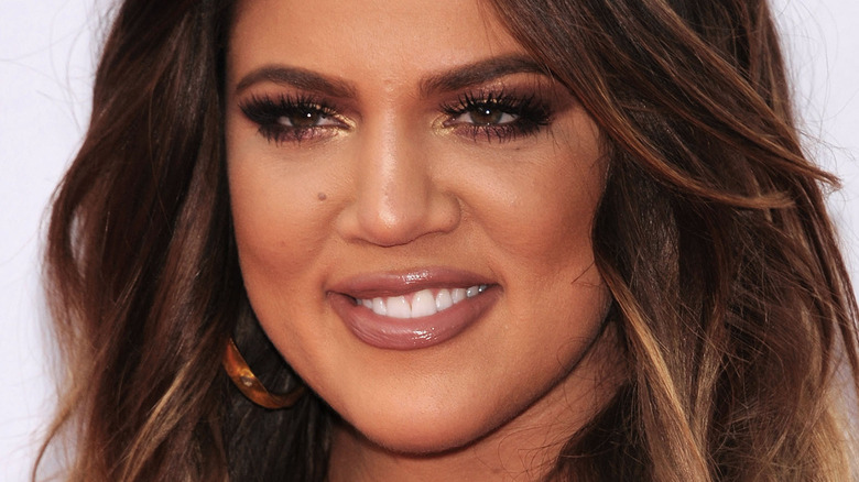 Khloe Kardashian smiling long brown hair