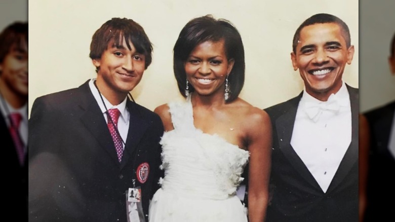 Robert James Ritchie Jr. posing with Michelle and Barack Obama in black tie