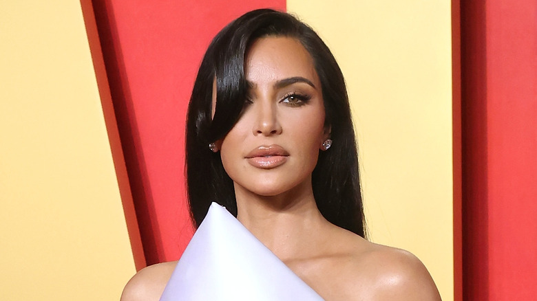 Kim Kardashian smiling in close-up at red carpet event
