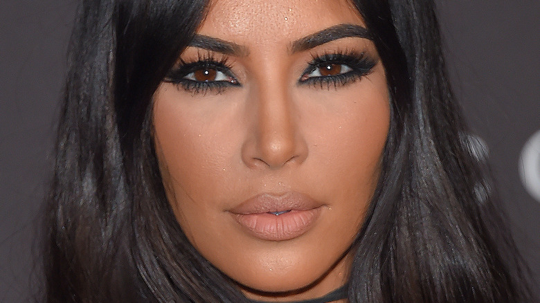 Kim Kardashian gives a smouldering look on the red carpet