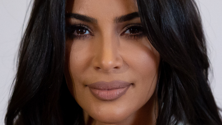 Kim Kardashian smiles 