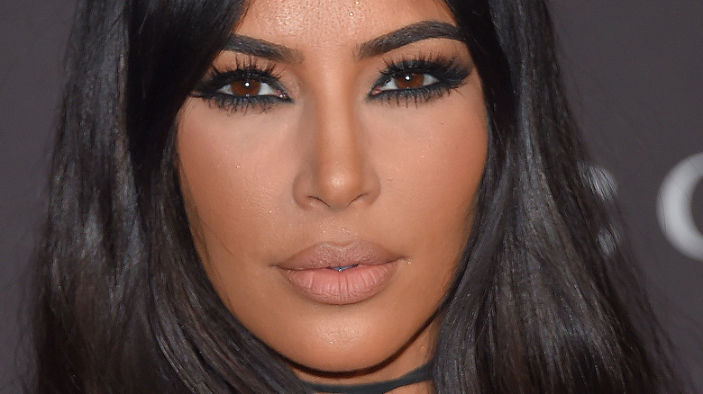 Kim Kardashian poses in black eye makeup