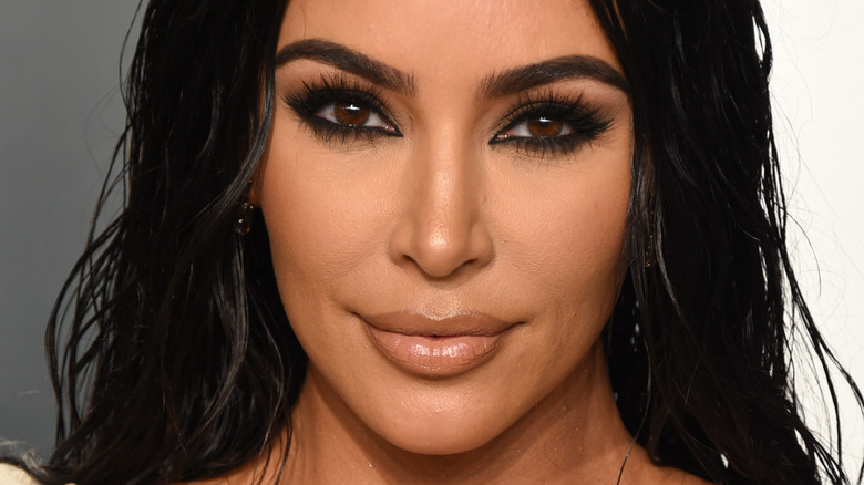 Kim Kardashian smirks