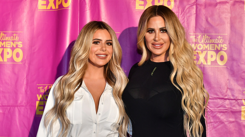 Brielle Biermann and Kim Zolciak smiling