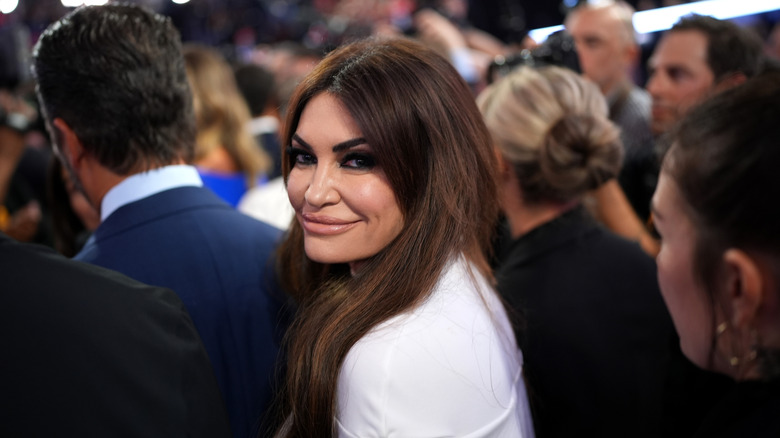 Kimberly Guilfoyle smiles at a political rally