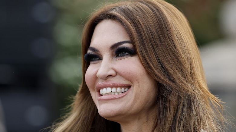 Kimberly Guilfoyle smiling with thick eye makeup