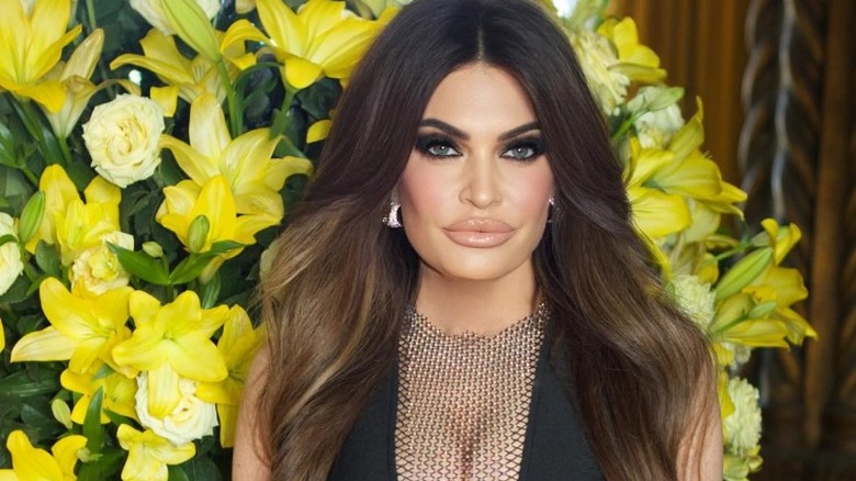 Kimerbly Guilfoyle in black dress with mesh panel