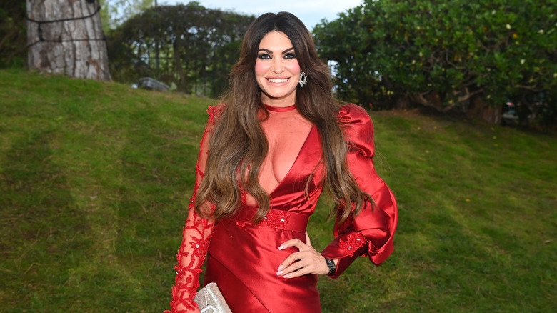 Kimberly Guilfoyle wears a red dress outside
