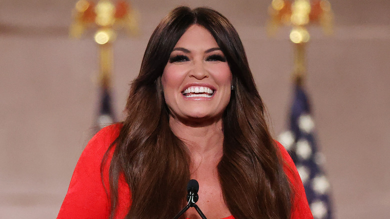 Kimberly Guilfoyle red dress grinning