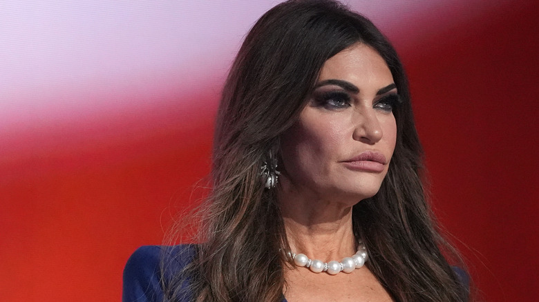 Kimberly Guilfoyle looking into distance at rally