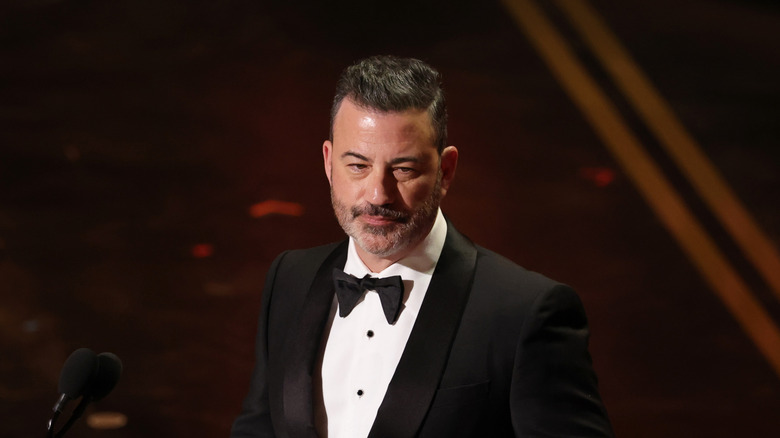 Jimmy Kimmel in a tuxedo on the 2026 Oscars stage