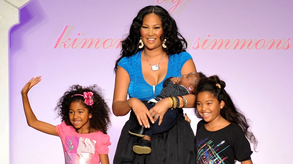 Kimora Lee walking the runway with her children