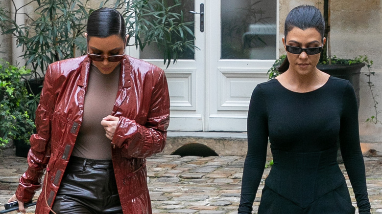 Kourtney and Kim Kardashian walking