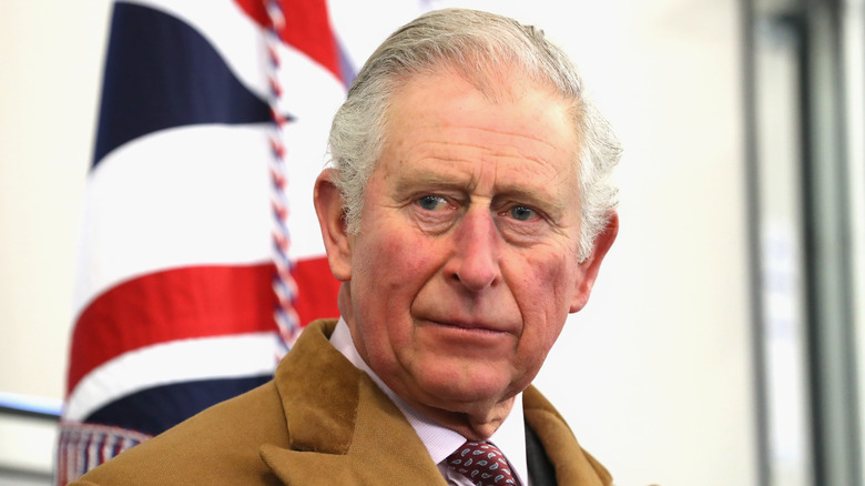 King Charles in front of Union Jack flag