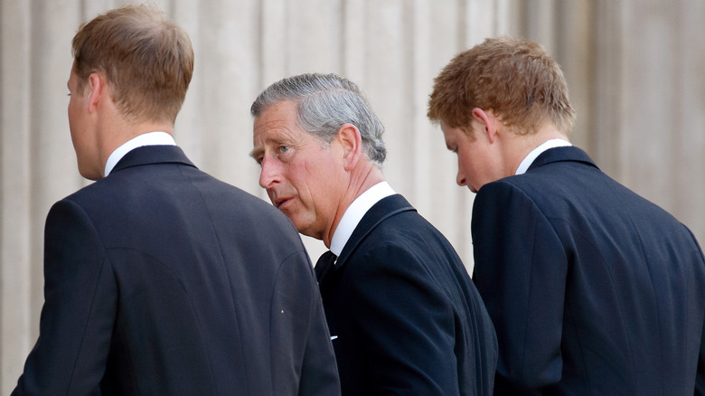 Prince Charles walking with his two sons
