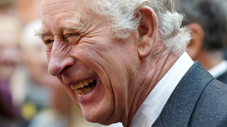 King Charles III laughing