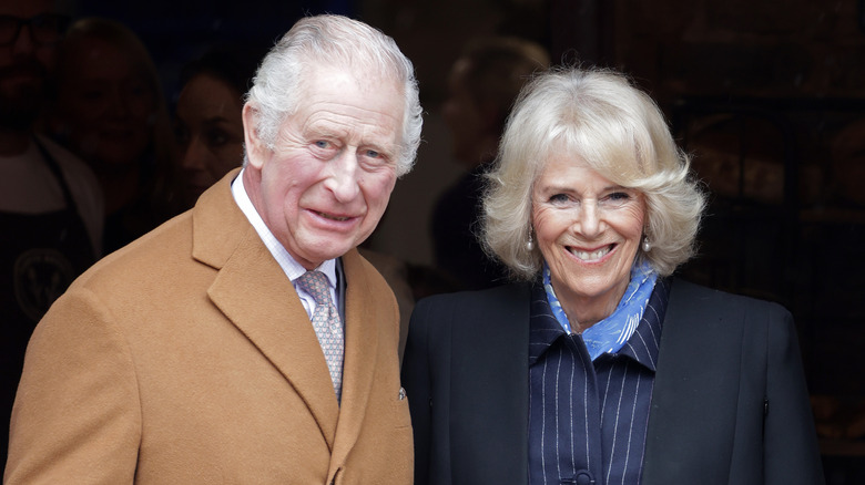 King Charles and Queen Camilla smiling