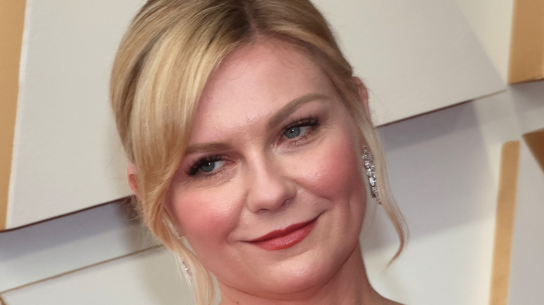 Kirsten Dunst smiling diamond hoop earrings