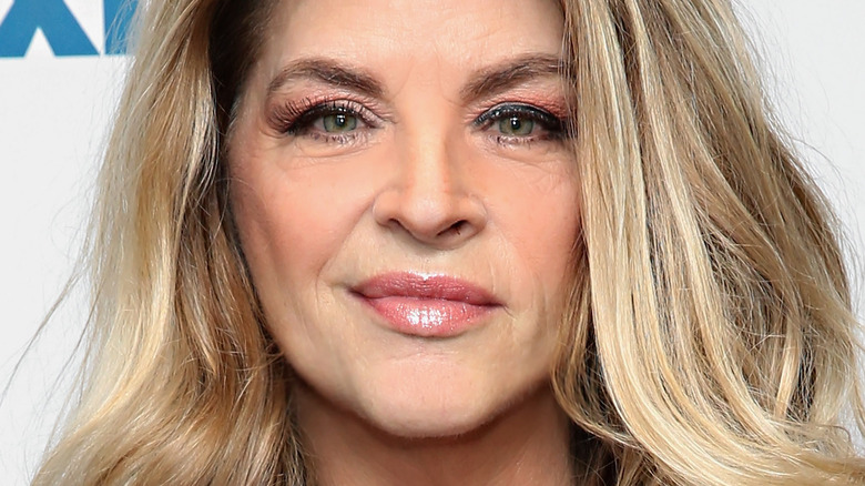 Kirstie Alley smiles with blonde hair