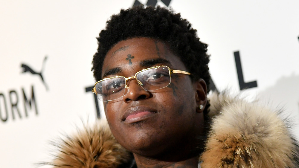 Kodak Black smiling slightly