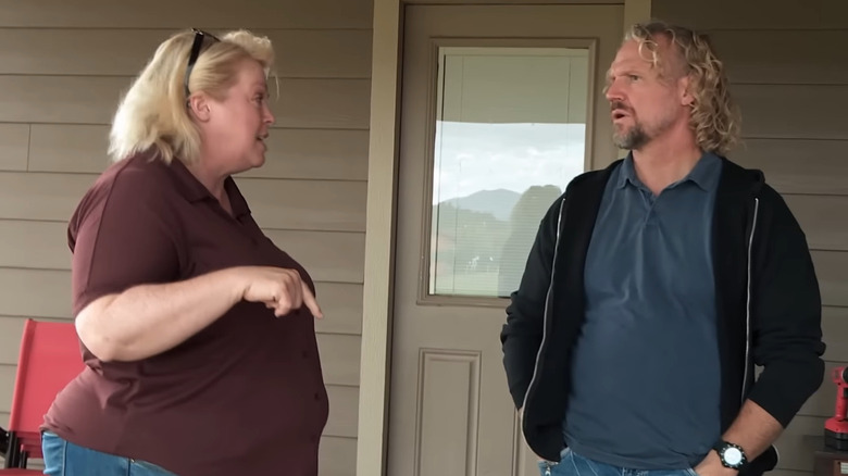 Janelle and Kody Brown argue outside their home
