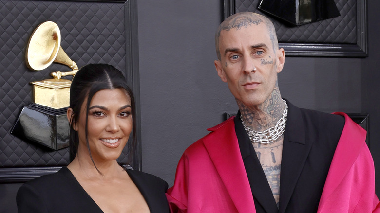 Kourtney Kardashian and Travis Barker smiling