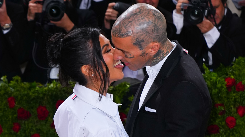 Kourtney and Travis kissing