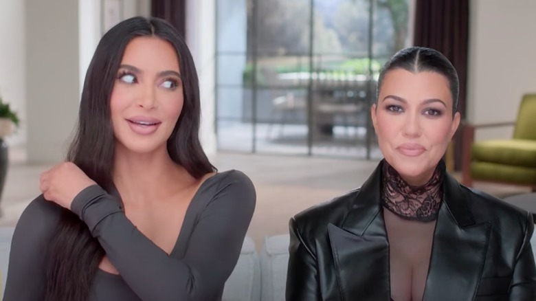 Kim Kardashian and Kourtney Kardashian during a confessional
