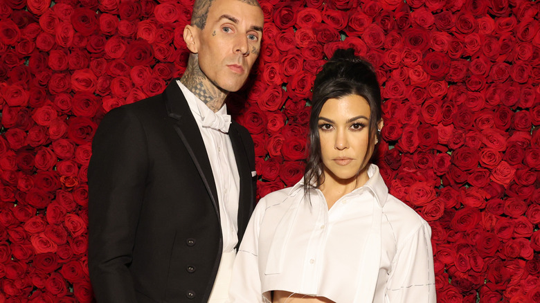 Kourtney Kardashian and Travis Barker posing