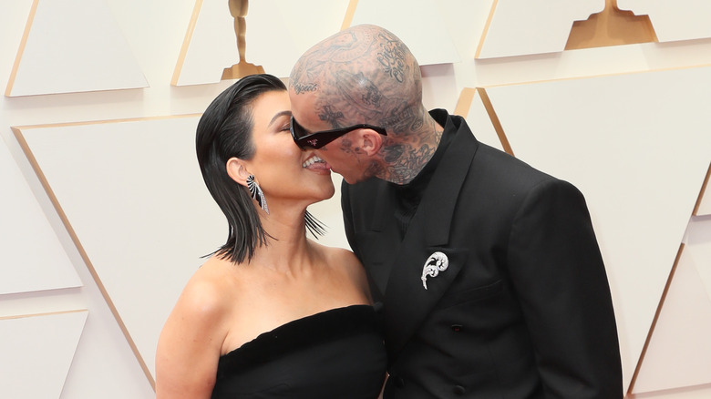 Kourtney Kardashian and Travis Barker kissing