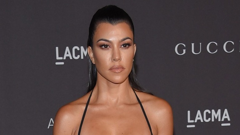 Kourtney Kardashian posing