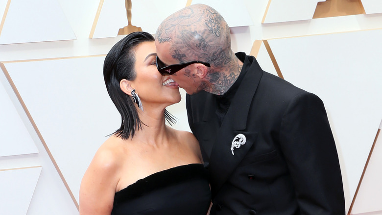  Kourtney Kardashian and Travis Barker attending awards event