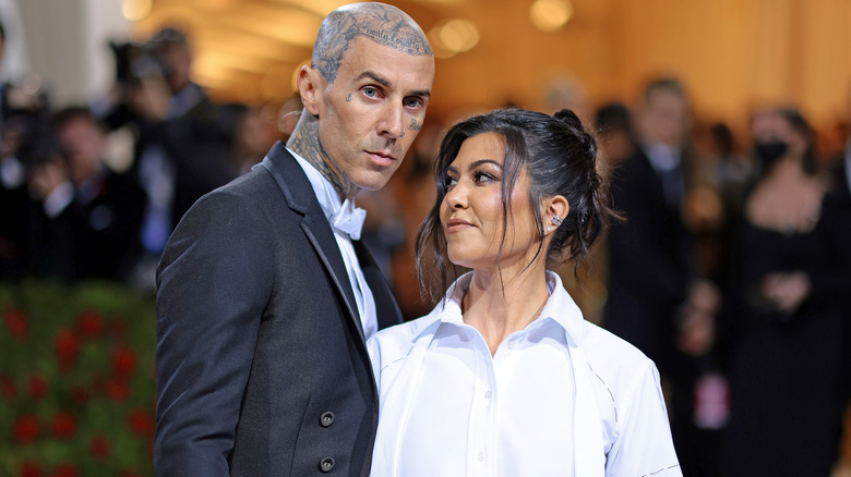 Kourtney Kardashian looking at Travis Barker
