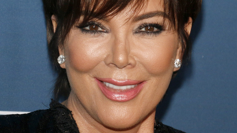 Kris Jenner short hair smiling diamond earrings