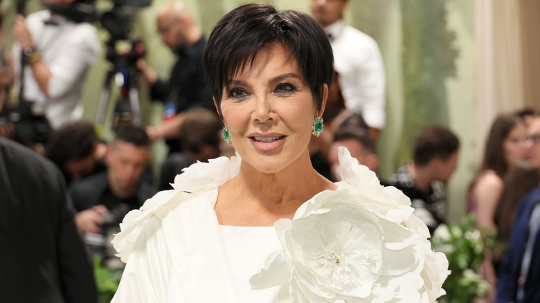 Kris Jenner posing in white at the 2025 Met Gala