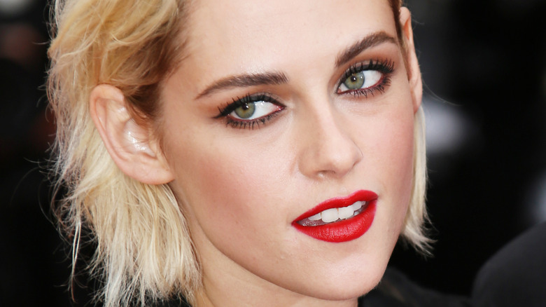 Kristen Stewart poses in red lipstick