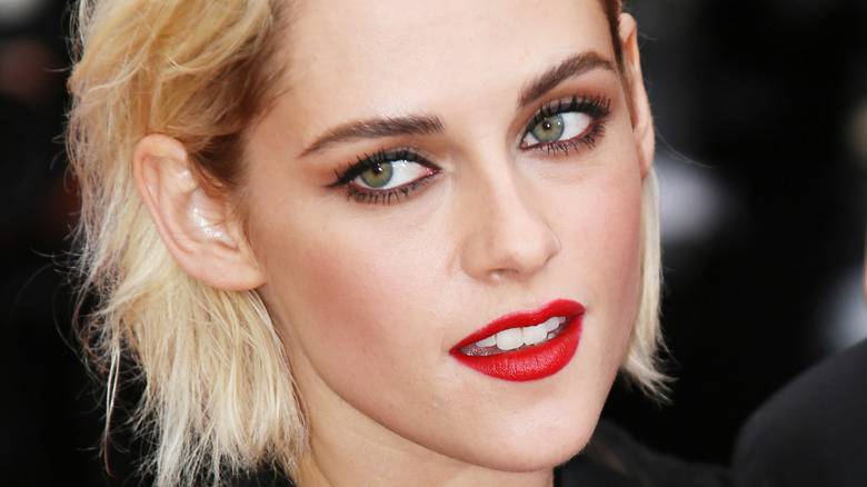 Kristen Stewart poses in red lipstick
