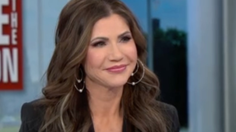 Kristi Noem smiling during an appearance on "Face the Nation"