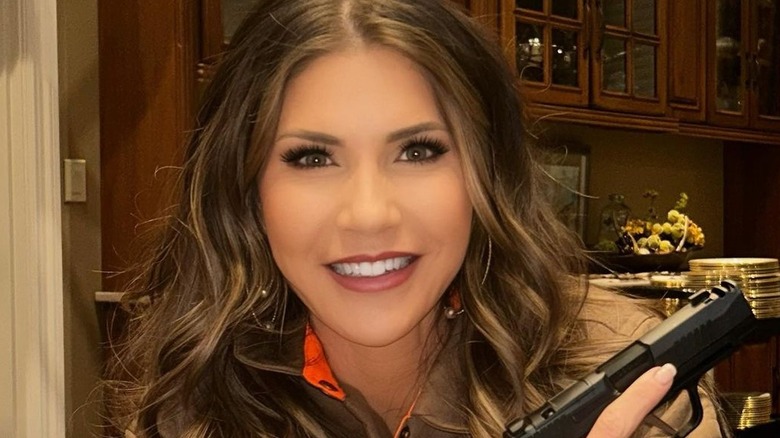 Kristi Noem holding handgun 