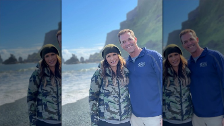 Kristi Noem and her husband, Bryon, posing at the beach together