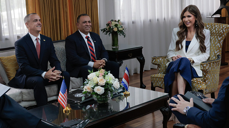 Kristi Noem and Corey Lewandowski at a meeting.