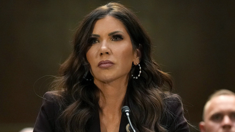 Kristi Noem listening during a hearing