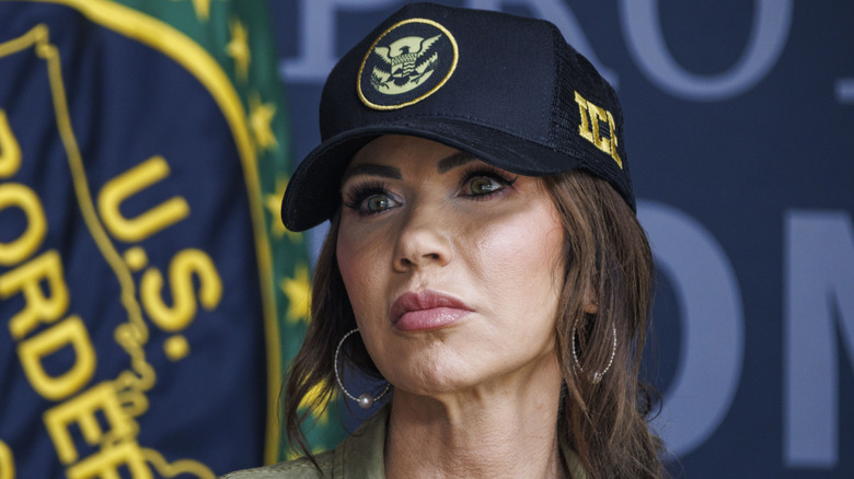 Kristi Noem photographed wearing a navy ICE cap