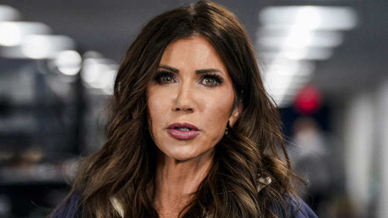 Kristi Noem appears tense as she speaks with reporters