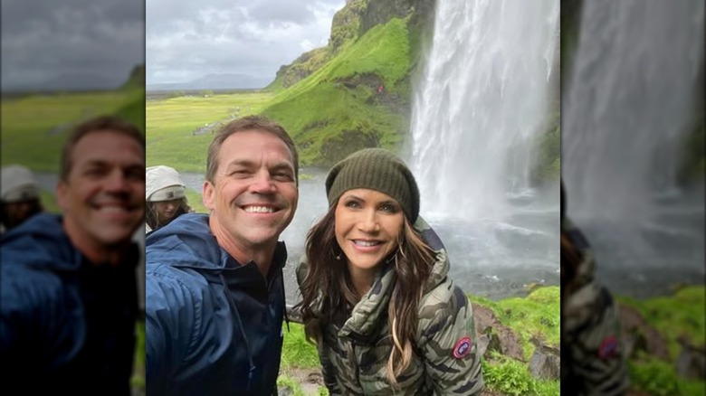 Bryon and Kristi Noem pose for a selfie at a waterfall.