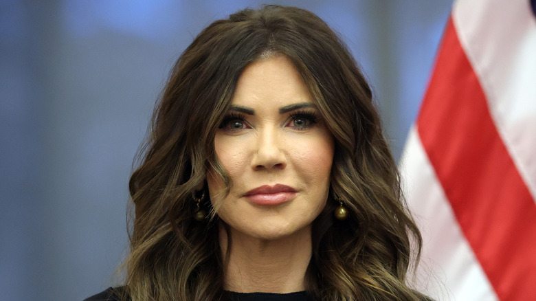 Kristi Noem standing on stage