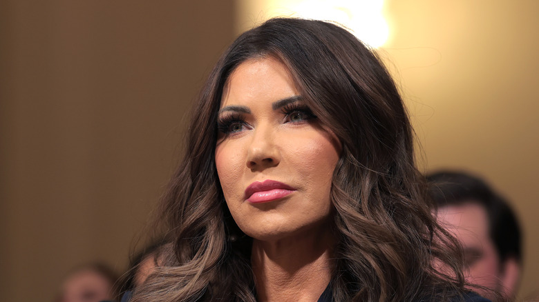 Kristi Noem listening during a hearing