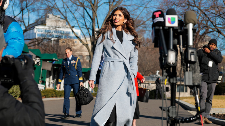 Kristi Noem wearing a long coat