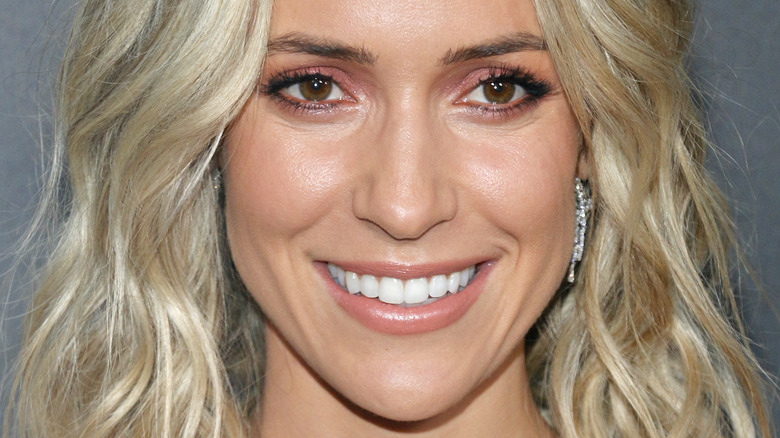 Kristin Cavallari smiles in drop earrings
