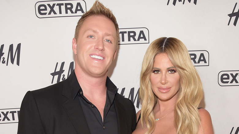 Kroy Biermann and Kim Zolciak posing